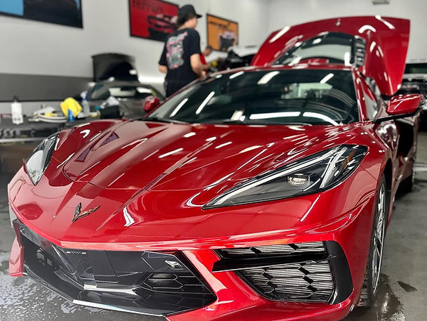 Glossy red sports car after ceramic coating by Detail Masters